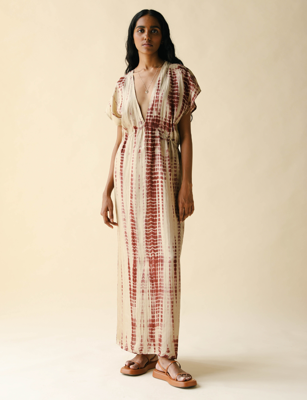 atlas maxi dress Our Atlas maxi is a timeless black silhouette revisited ~ smock-inspired, softly structured, and finished with bespoke Greek key lace for modern travel ease..